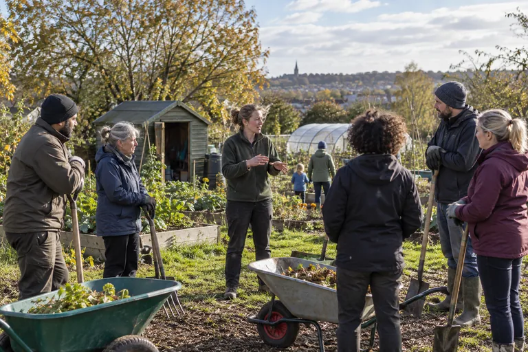 Illustrative community volunteers talking in a garden